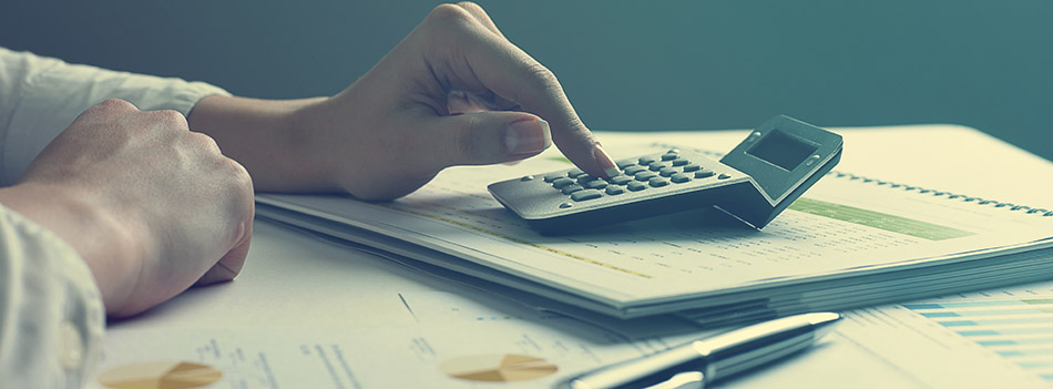 Analyzing Business Data - pen and numbers on paper