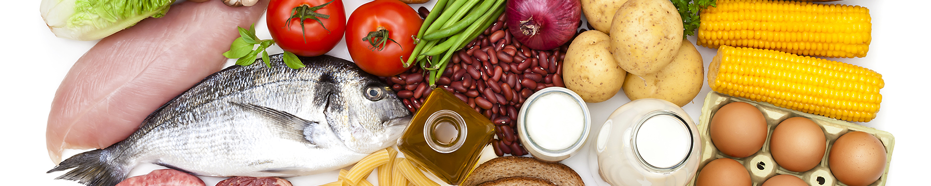 Top view of a white table filled with a large group of different types of food like carbohydrates, protein and dietary fiber. Food included in the composition are dairy products, sausages, minced meat, poultry, fish, bread, pasta, rice, beans, nuts, olive oil, fruits and vegetables. DSRL studio photo taken with Canon EOS 5D Mk II and Canon EF 70-200mm f/2.8L IS II USM Telephoto Zoom Lens